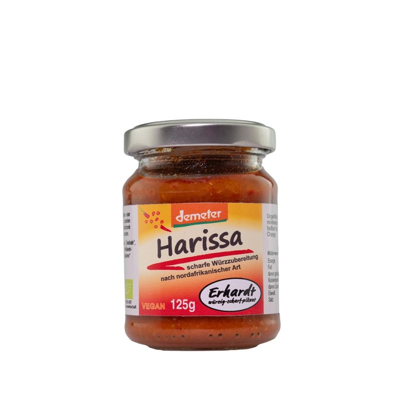 Erhardt würzig • scharf • pikant Demeter Harissa 125g, unsere nordafrikanische würzig-scharfe Soße passt optimal zu Merquez und Gegrilltem. Ob Gemüse, Fleisch oder Tofu. Unser Harissa  harmoniert und verfeinert ihre  Sinne. - Produktbild