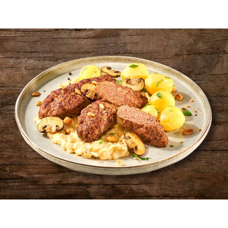 Karl Kemper Frikadelle aus z.T. fein zerkleinertem Rindfleisch geformt, küchenfertig gewürzt, mit Petersilie verfeinert, gegart, gebräunt, tiefgefroren, zum nochmaligen Erhitzen - Produktbild