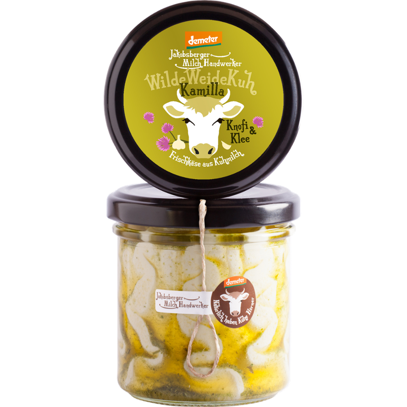 Jakobsberger MilchHandwerker WildeWeideKuh Kamilla mit Knofi & Klee ist ein demeter Kuhmilchfrischkäse von den Jakobsberger MilchHandwerkern. Mit Schabziger Klee schmeckt Kamilla nach einem gut abgerundeten Kräuterfrischkäse - Produktbild