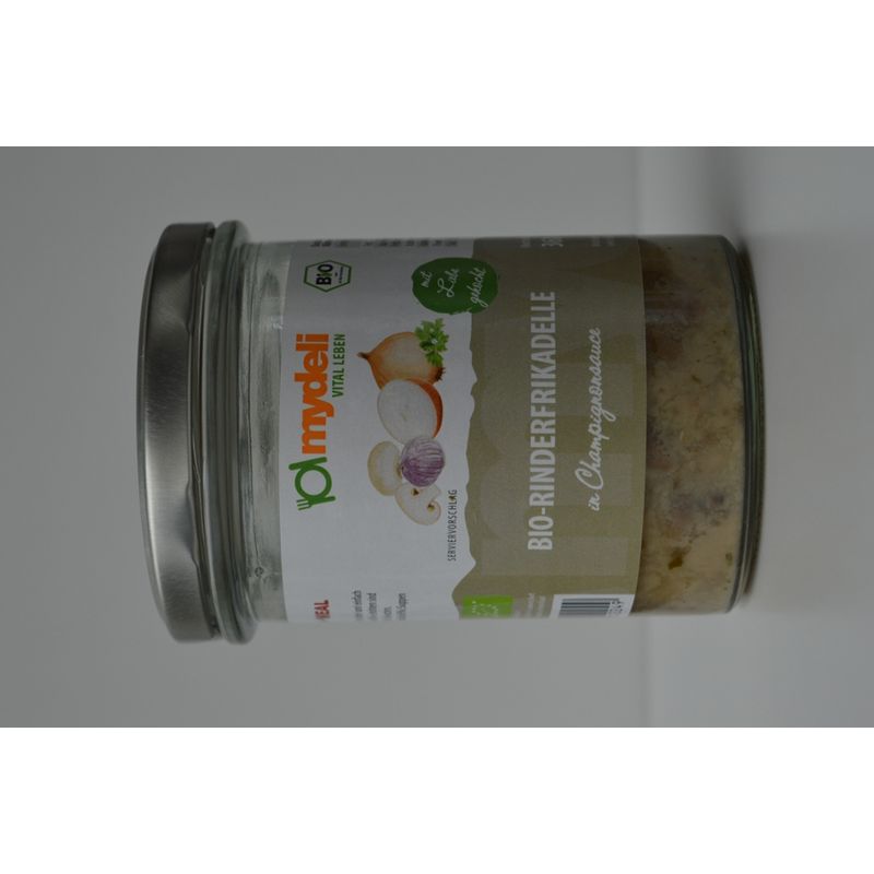 mydeli Saftige Bio-Rinderfrikadellen in cremiger Champignonsauce mit feiner Gemüseeinlage. Die Sauce ist herzhaft abgeschmeckt und unterstreicht den arttypischen Geschmack von Rindfleisch und Pilzen. - Produktbild